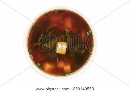 A Photo Of A Bowl Of Miso Soup With Tofu, Scallions, And Wakame Seaweed, Shot From The Top, Isolated