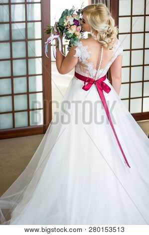 Beautiful Bride Softly Holds Wer Vintage Wedding Bouquet.