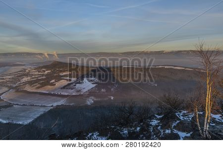 Sunrise On Boren Hill Near Bilina Town In Winter Frosty Color Morning