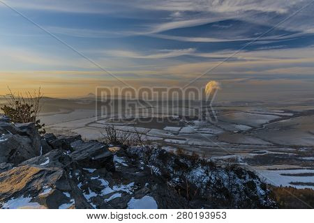 Sunrise On Boren Hill Near Bilina Town In Winter Frosty Color Morning