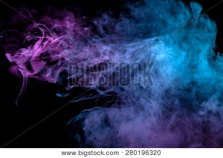 Multicolor, Thick Smoke, Illuminated By Colored In Blue, Purple And Pink Light Against A Dark Black 