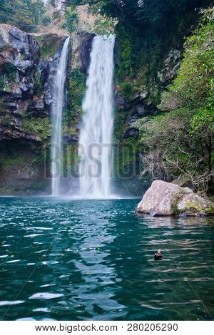 Cheonjiyeon waterfall falls one of tourist attractions of Jeju Island, South Korea