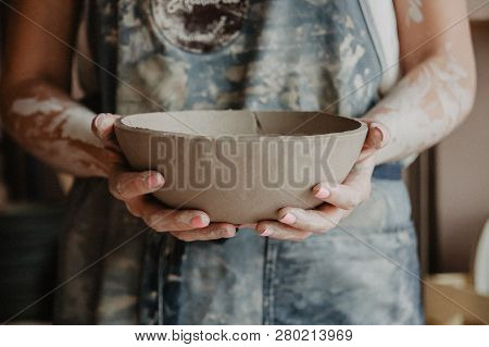 Pottery, Clay, Ceramics Art Concept - Closeup On Hands Of Young Master With The Large Plate From Fir