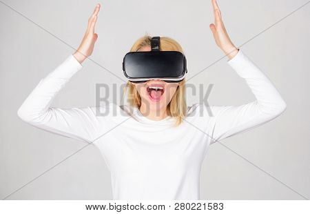 Excited Smiling Businesswoman Wearing Virtual Reality Glasses. Woman Watching Virtual Reality Vision