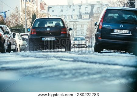 Strasbourg, France - Dec 18, 2018: Rear Low Anlge View Of Volkswagen Golf Car Driving On The Snowy R