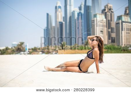 Sexy Beautiful Woman Lying Relaxing And Sunbathing In Bikini On Sea Background And Palm Tree. Panora