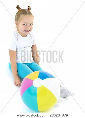 A Charming Little Girl Is Engaged In Fitness With A Ball. The Concept Of Gymnastics, Health And Spor