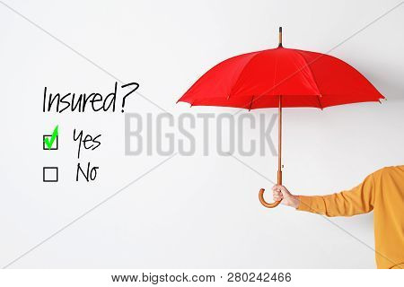 Positive Answer To Question Whether Insured Or No And Person Holding Open Umbrella On White Backgrou
