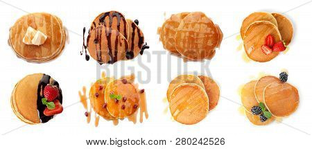 Set Of Delicious Pancakes With Different Toppings On White Background, Top View