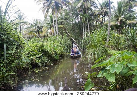 Backwaters, India - August 24: Tourists In Canoe On August 24, 2011 In Backwaters, India. The Kerala