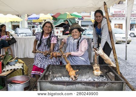 Cuenca, Ecuador - March 13, 2016 - Three Women Bbq Cuy For Lunch At An Outdoor Festival