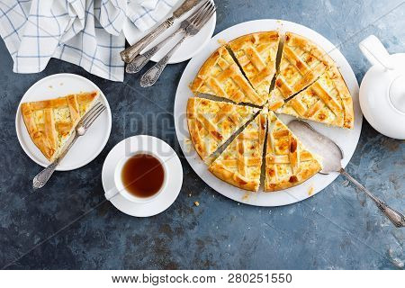 Pie With Salted Soft Cheese And Greens, Top View