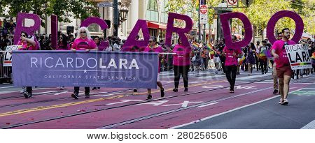 San Francisco, California, June 24, 2018:  Gay Pride Parade - Senator Ricardo Dolara Supporters Marc