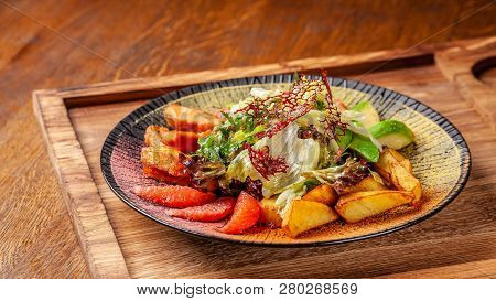 Modern Arabic Cuisine In 2019. Asian Salad Of Fried Salmon, Avacado, Grapefruit And Salad Mix, With
