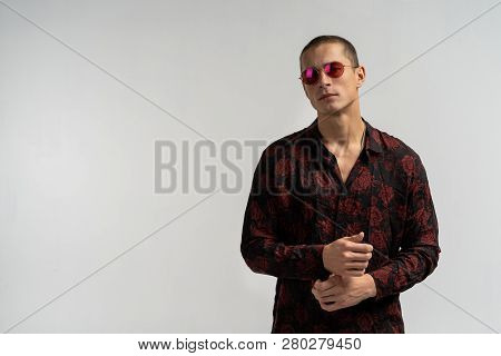 Cheerful Young Man In Sunglesses, With Blank Copyspace Area For Slogan Or Advertisiment Text, Over G