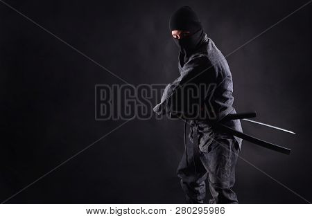 Ninja, Samurai Preparing To Draw His Sword