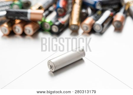 Universal Battery Compared To Other Batteries On A White Background