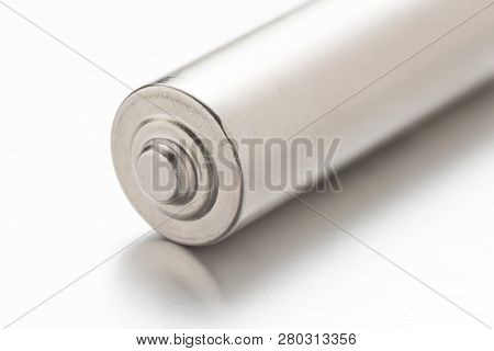 Universal Silver Battery On White Background With Reflection