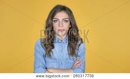 Sad Upset Young Girl Isolated On Yellow Background
