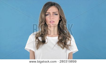 Sad Upset Young Girl Isolated On Blue Background