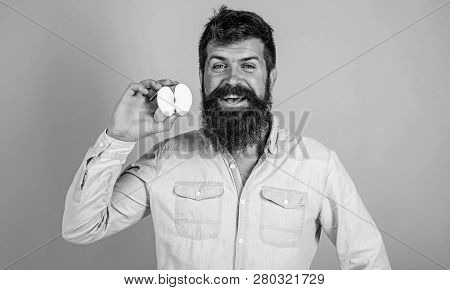 Man Bearded Smiling Holds Apple Blue Background. Healthcare Dieting Vitamin Nutrition. Half Of Apple