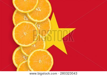 Vietnam Flag And Citrus Fruit Slices Vertical Row