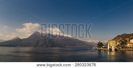 Panoramic View Of Lake Como And Surrounding Mountains As Viewed From Varenna, Lombardy, Italy