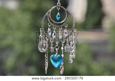 Magical Power. Name Amulet For Good Luck. Silver Amulet With Gems And Pendants. Luck Amulet Hung Out