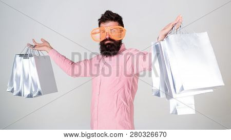 How To Get Ready For Your Next Vacation. Man Bearded Hipster With Lot Shopping Bags. Shopping On Bla