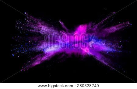 Explosion of colored powder isolated on black background. Abstract colored background