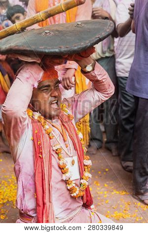 Barsana, India - February 24, 2018 - Lathmar Holi Festival - Women Beat Men With Bamboo Sticks Until