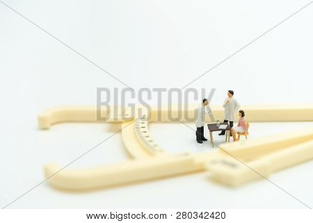 Miniature People Consult A Doctor To Ask For Health Problems. Annual Health Check Or Consult A Docto
