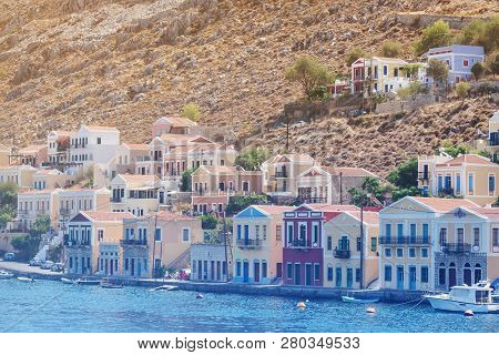 Seascape With Panoramic View Of The Traditional Colorful Houses And The Port Called Yalos With The S