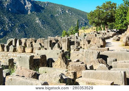Delphi, Greece: Picturesque Ruins On The Background Of Green Mountains, Center Of Greek Culture.
