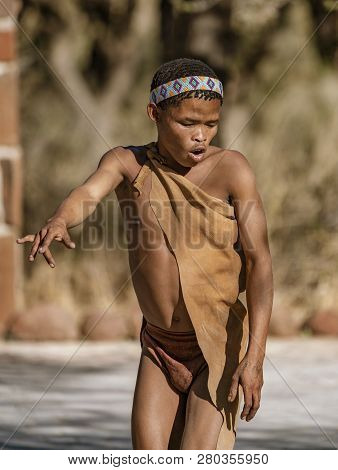 Erindi, Namibia - July 19, 2018: A Native Bushman Gives A Farewell Dance To Wish Good Hunting To The