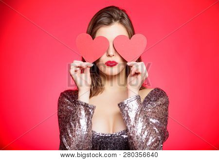 Obsession Concept. Fall In Love. Girl Adorable Fashion Model Makeup Face Hold Heart Valentines Card.