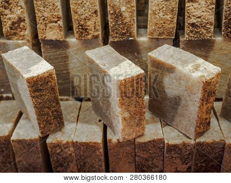 Bars Of Soap On A Shop Window. Cinnamon Soap With Natural Cedar Oil And Herbal Ingredients. Handmade