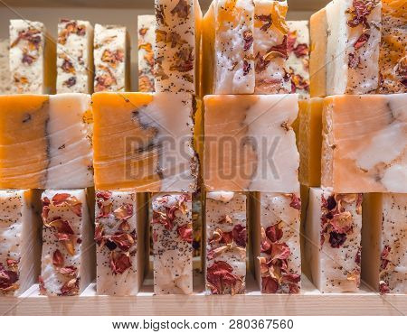 Bars Of Soap On A Shop Window. Ylang-ylang Soap With Natural Cedar Oil And Herbal Ingredients. Handm