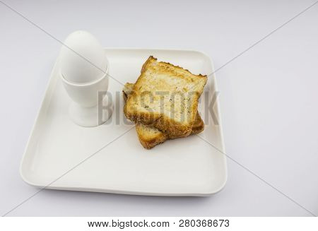Boiled Egg On White Background, Isolate. Egg In Stand, Space For Text