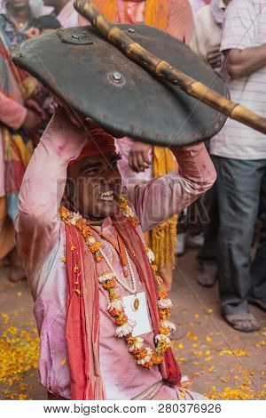 Barsana, India - February 24, 2018 - Lathmar Holi Festival - Women Beat Men With Bamboo Sticks Until