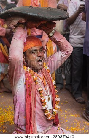 Barsana, India - February 24, 2018 - Lathmar Holi Festival - Women Beat Men With Bamboo Sticks Until