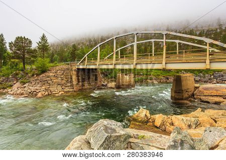 Bridge Over Mountain River, Norwegian Landscape. Cloudy Foggy Day, Rainy Weather. Saltfjellet - Svar