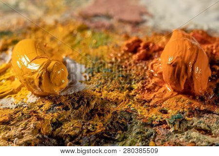 Oil Art Paints On A Very Old Palette. Close-up