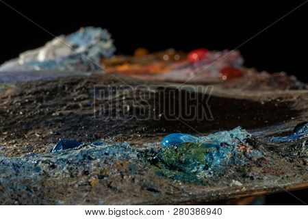 Oil Art Paints On A Very Old Palette. Close-up