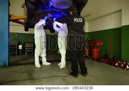 Crime Investigation - Collecting Of Evidences And Traces From Chassis Of Suspected Car In Police Gar