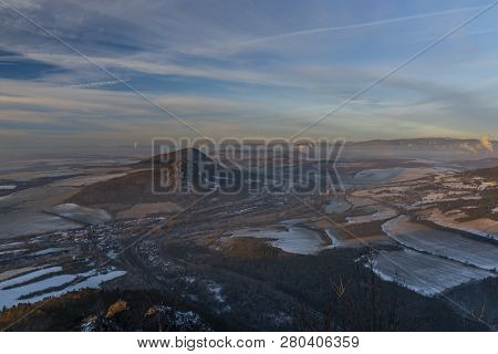 Sunrise On Boren Hill Near Bilina Town In Winter Frosty Color Morning