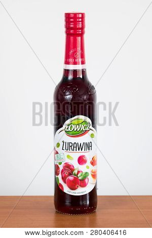 Pruszcz Gdanski, Poland - January 24, 2019: Lowicz Cranberry Juice In A Glass Bottle On Wooden Table