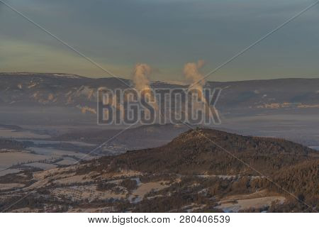 Sunrise On Boren Hill Near Bilina Town In Winter Frosty Color Morning