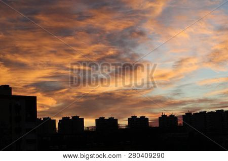 Colors And Lights Of The Sun Reise On The Sky  Above The City