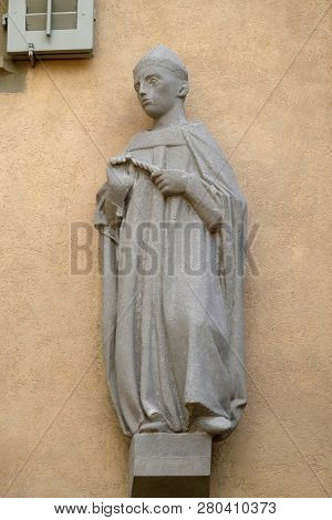 LUCERNE, SWITZERLAND - JUNE 24, 2018: The statue of the Leodegar in the courtyard of the church of St. Leodegar in Lucerne, Switzerland